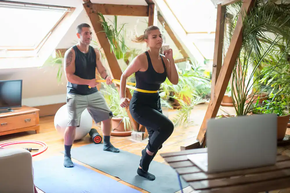 One on one personal training session in a home space