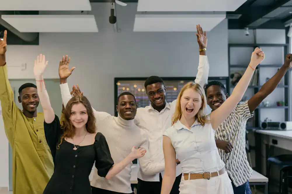 Colleagues stretching in an open office space